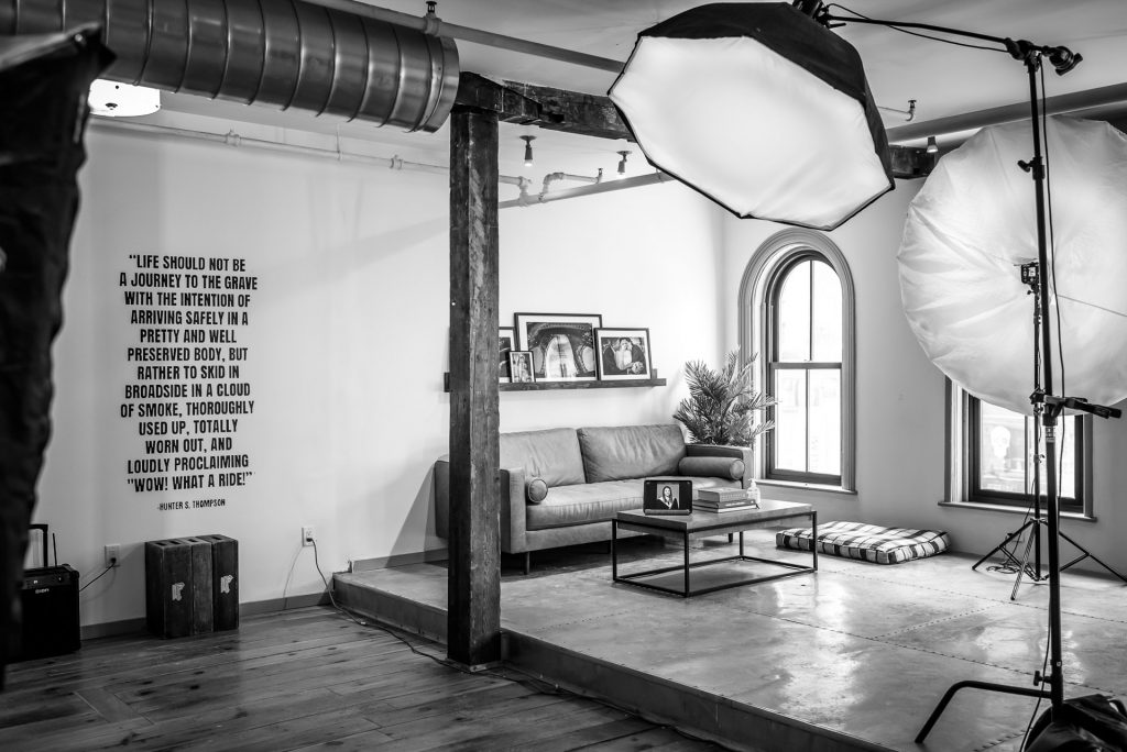 headshot photography studio with lighting setup and display